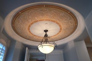 Medallion painted on thin material and installed